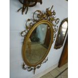 A handsome late Victorian Adam style mirror, with griffin and urn surmount, scrolling leaves and