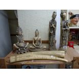 A pair of resin Oriental figurines, two resin scrimshaws and two further figurines, a quantity of