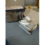A box of modern brocade curtains, still in packaging, and a small box of vintage baby clothes and