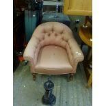 A Victorian deep armchair of horseshoe form in buttoned pink fabric, an open tub chair with inlaid