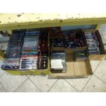 Four boxes of DVD's and CD's including Allo Allo and the David Starkey collection etc. plus a box of