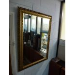 A large rectangular gilt framed mirror with open pierced work decoration. WE DO NOT ACCEPT CREDIT