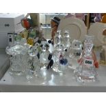 Two perfume bottles and stoppers and a collection of crystal animal ornaments including bears,