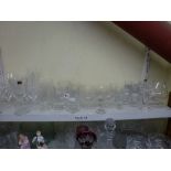 A quantity of glassware including cut-glass wine glasses red and white, decanter and stopper,