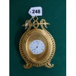 A fine quality desk clock in gilt metal, lyre-shaped easel frame, by Howell James & Co 'to the
