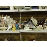 A large collection of miscellaneous ornaments and figures including Crown Naples figurines, Sylvac