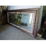 A very large modern bevel edged silver painted framed mirror approximately 134 in x 34 in. WE DO NOT