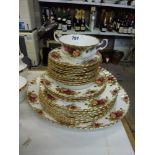 A Royal Albert part table services Old Country Rose pattern including plates and carving plate [
