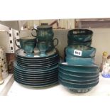 A Denby part-dinner and tea service in a deep greeny-blue, approximately 48 pieces, including cereal
