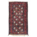 A TEKKE RUG EARLY 20TH CENTURY. SIGNED.