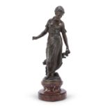 BRONZE SCULPTURE OF A GIRL WITH FLOWERS LATE 19TH CENTURY