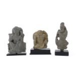 THREE SCHIST FIGURES DEPICTING ATLAS AND HARITI ART OF GANDHARA 2ND-3RD CENTURY A.C.