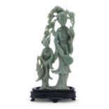A JADE SCULPTURE DEPICTING HE XIANGU WITH FEMALE ATTENDANT CHINA 20TH CENTURY