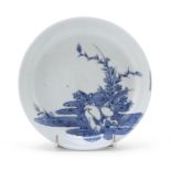 A SMALL WHITE AND BLUE PORCELAIN DISH ARITA JAPAN 1670/1680