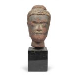 A RARE RED SANDSTONE HEAD OF BUDDHA THAILAND 17TH CENTURY