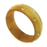 BANGLE IN YELLOW BAKELITE AND STRASS