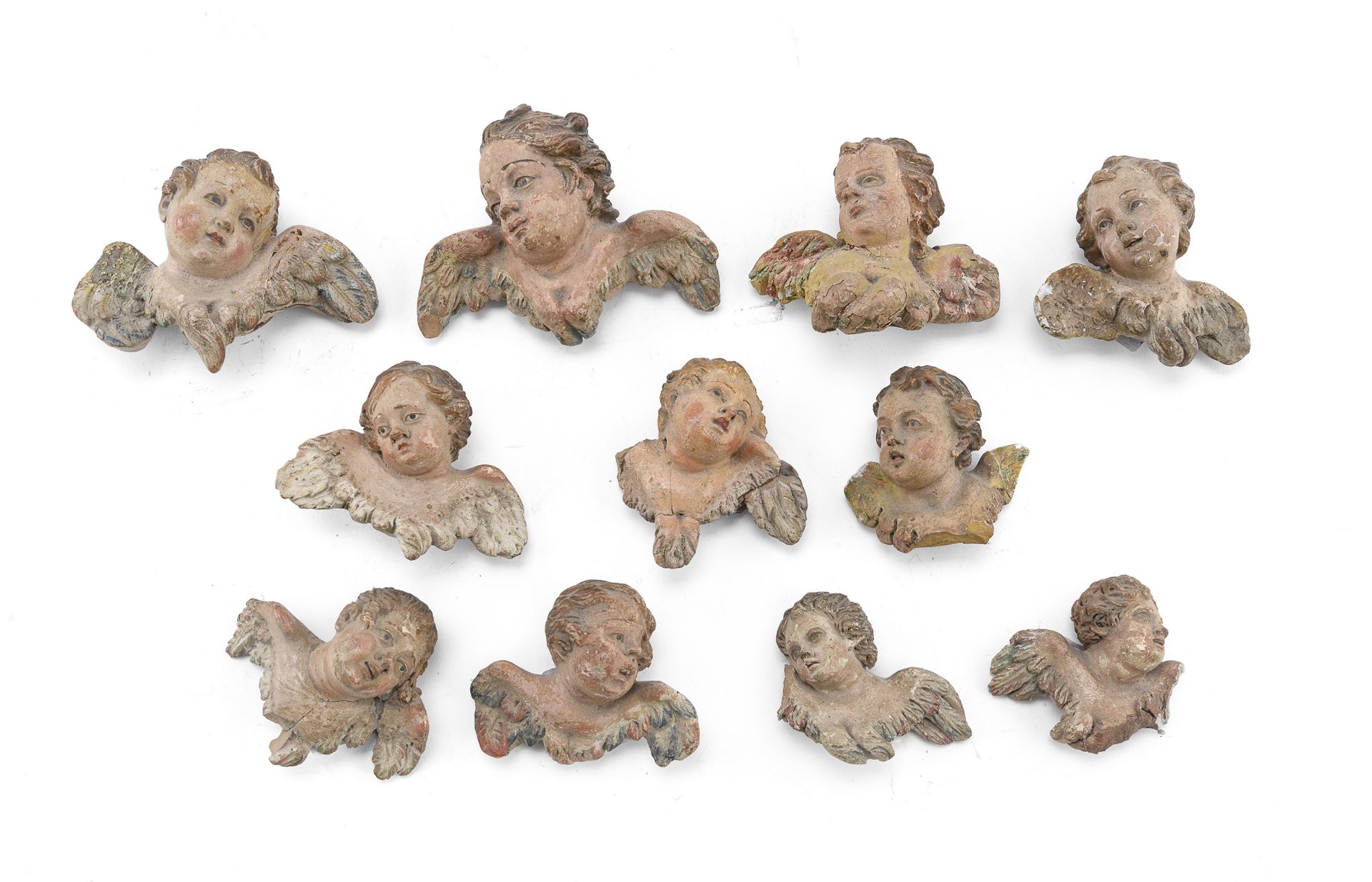 ELEVEN CERAMIC HEADS OF CHERUBS FOR NATIVITY SCENE NAPLES 19TH CENTURY