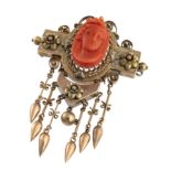 GOLD BOURBON BROOCH WITH CARVED CORAL