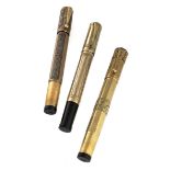 THREE GOLD AND SILVER PENS