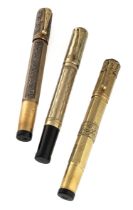 THREE GOLD AND SILVER PENS