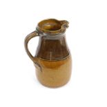 RICHARD BATTERHAM. A quart jug with amber glaze by Richard Batterham. Height 23cm.