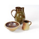 MULCHENEY POTTERY. A Muchelney Pottery ¼ pint jug & a bowl. Jug 9cm., bowl diameter 16cm.
