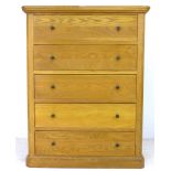 A contemporary oak chest of five drawers, with pine back, 101 by 46 by 130.5cm high.