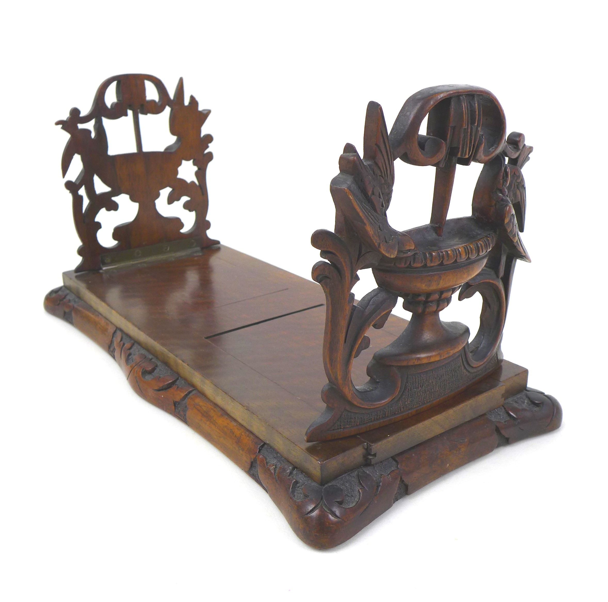 A carved mahogany book slide, each end ornately carved to depict birds drinking from a bird bath - Image 5 of 7