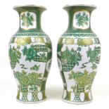 A pair of modern Chinese porcelain baluster vases, decorated in green and gilt, printed marks,