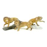 A group of Beswick animal figurines, comprising a Beswick Lion - standing, model 2554B, golden brown