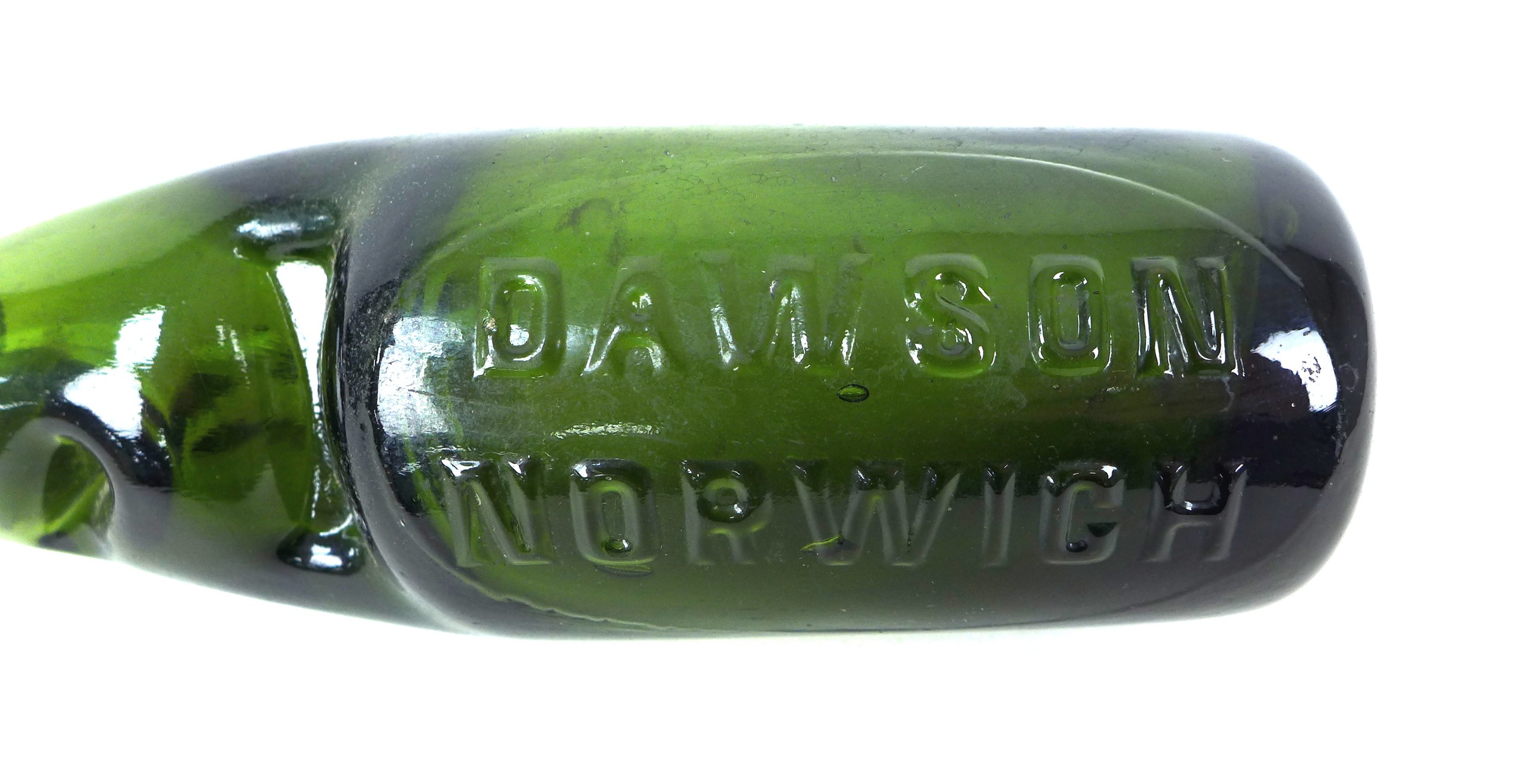 A Dawson of Norwich Codd bottle, dark green glass with marble still intact, heavily embossed 'DAWSON - Image 4 of 4