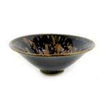 A Chinese porcelain bowl, of conical form with small foot rim, with very dark blue and brown speckle