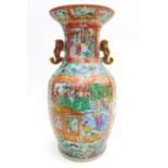 A Canton porcelain vase, late 19th century, of baluster form with twin handles, a/f cracked and