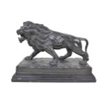 After Antoine-Louis Barye: a late 20th century bronze casting of a lion, on naturalistic base with