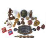 A collection of African and Asian wooden ethnographical items, including a double headed tray with