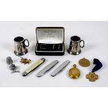A group of collectables, comprising two miniature silver tankards with glass bases, engraved '