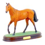 A Royal Doulton figurine of the racing horse Red Rum, raised upon a wooden plinth, 25.5 by 10.5 by