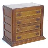 An Art Deco style apprentice piece mahogany miniature chest of four drawers, with satinwood inlays