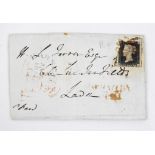 An 1841 penny black stamp, post mark 26th January 1841, affixed to an envelope.