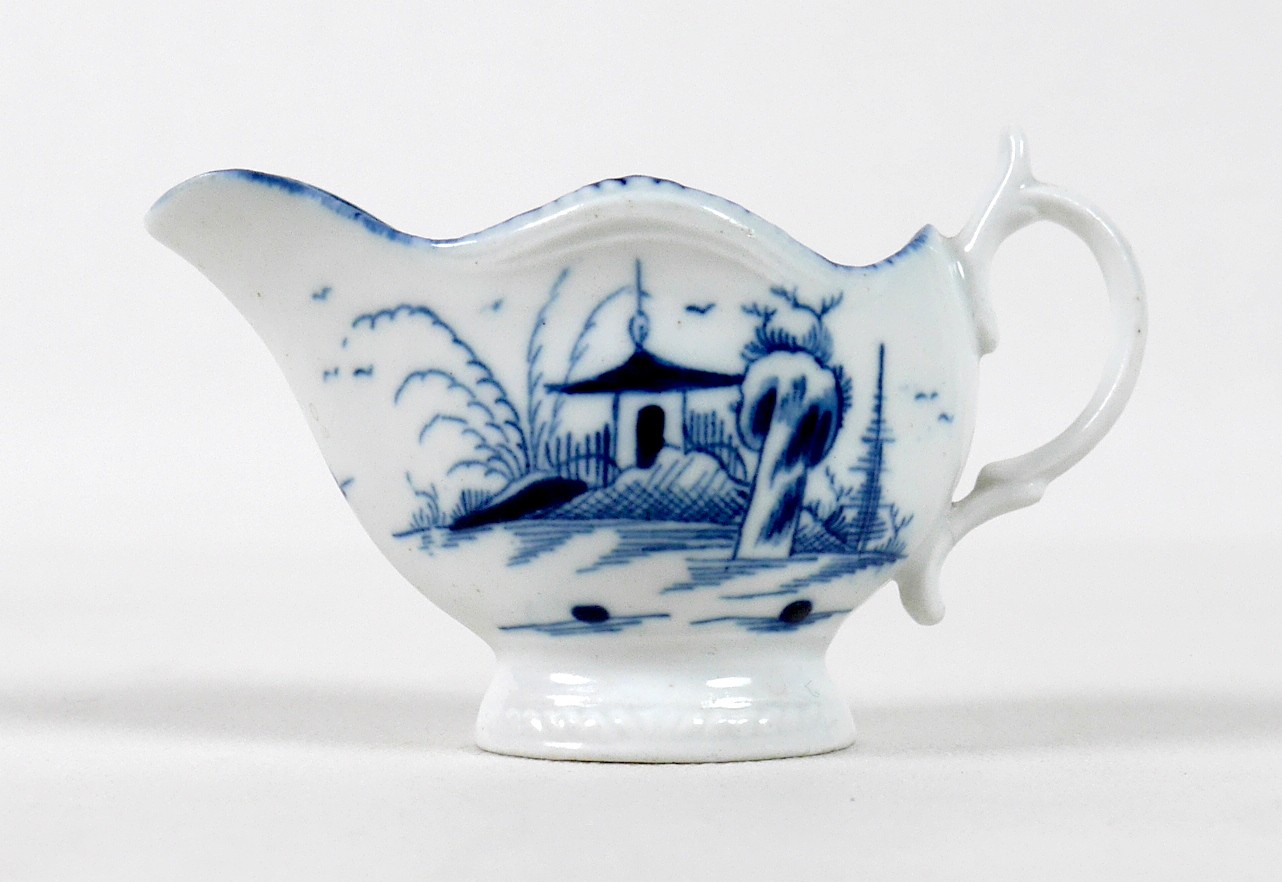 A late 18th century Caughley porcelain miniature milk jug