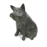 A Chinese bronze sculpture, modelled as a sitting pig, 8cm high.