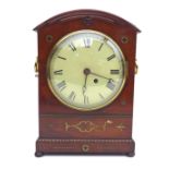 An early 19th century walnut mantel clock, with Roman numeral dial, single fusee eight day movement,