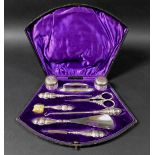 An Edwardian cased nine piece dressing set, all silver mounted, most Adie & Lovekin Ltd,