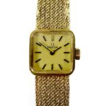 A vintage Omega 9ct gold lady's wristwatch, model 1061, circa 1973, the square matte gold dial