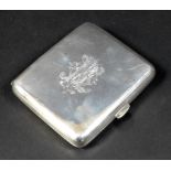 A late Victorian silver cigarette case, engraved to one side with an armorial crest 'Fac Et Spera'