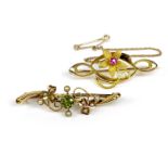 Two 15ct gold brooches, the first set with a peridot and seed pearls, 3.9cm, the second of floral