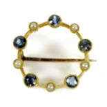 A 15ct gold, sapphire and pearl brooch, of opal circle design with five beaded rubover set