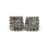 A pair of 18ct white gold and diamond stud earrings, of square design each formed of sixteen