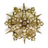 A 9ct gold, pearl and diamond starburst brooch, a/f one pearl missing, 3.4cm diameter, 5.3g.