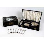 A sterling silver four piece dressing table set, with three silver backed hair brushes and one comb,
